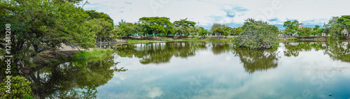 panoramic photo of a lake and the surrounding greenery