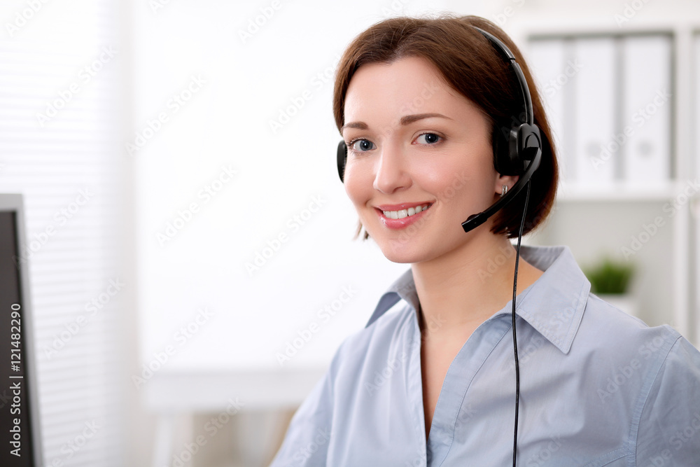 Young beautiful business woman in headset. Call center. Young beautiful business woman in headset. Call center.