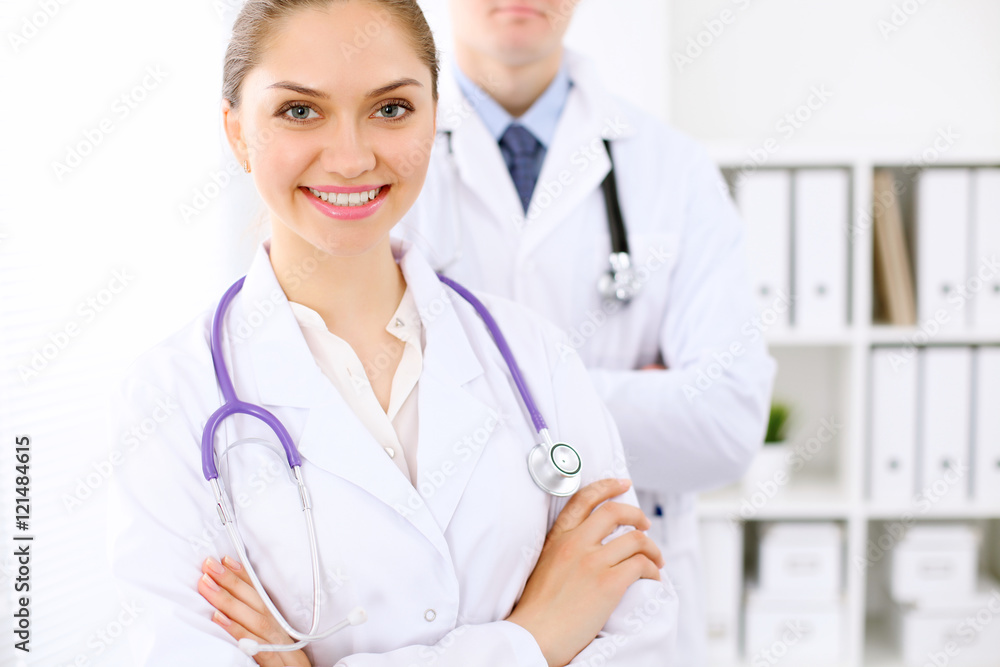 Happy doctor woman with medical staff at the hospital Happy doctor woman with medical staff at the hospital