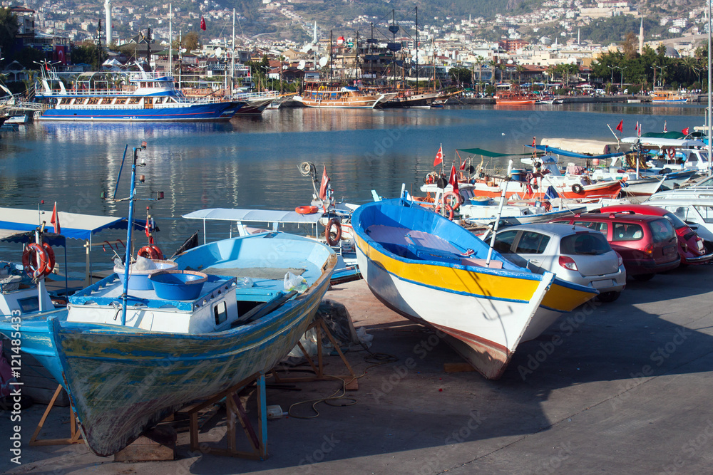 View of the old harbor and the fishing and touristic boats in Alanya. Turkey.