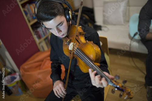 Teen playing a violin