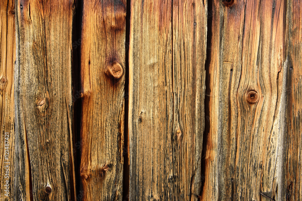 Alte Holzbretter als rustkaler Hintergrund mit Struktur und Astlöcher Alte Holzbretter als rustkaler Hintergrund mit Struktur und Astlöcher