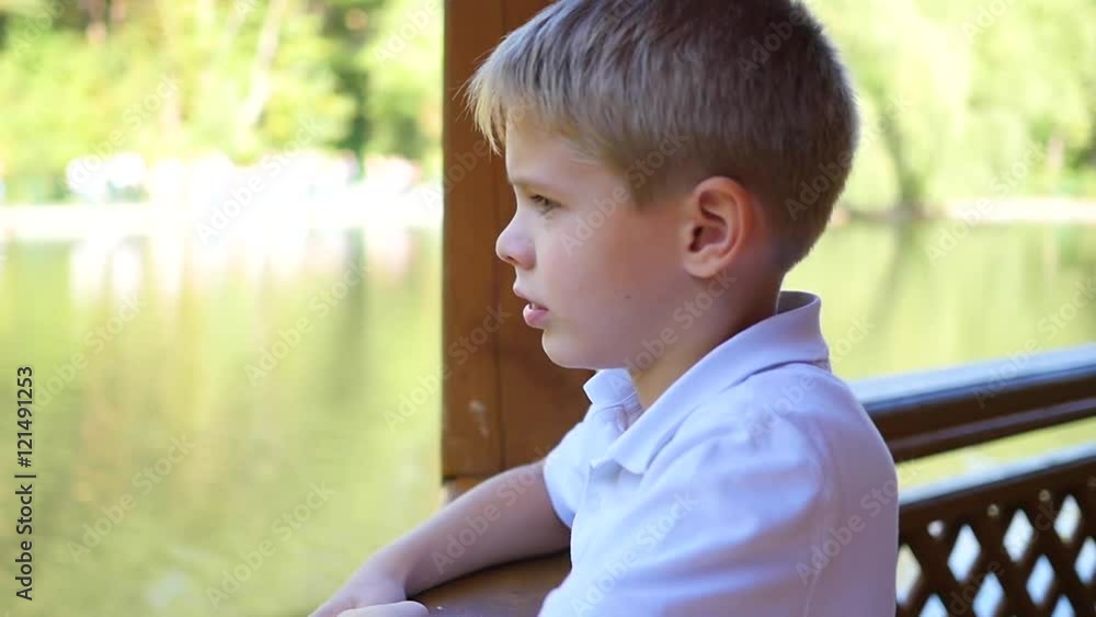 the beautiful child in the gazebo looking at the lake the beautiful child in the gazebo looking at the lake