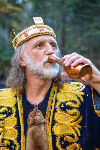 Old king drinking from the goblet