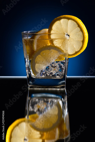Gin with tonic; ice and lemon