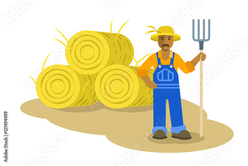 African American farmer man standing with pitchfork near group of hay bales. Vector flat illustration. Farming cartoon character. Organic agriculture concept. Smallholder harvesting in work uniform