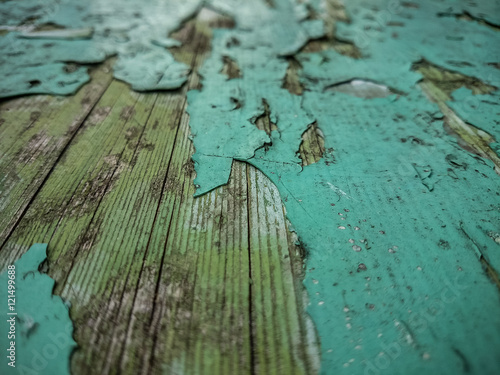 Wood background with old green peeling paint photo