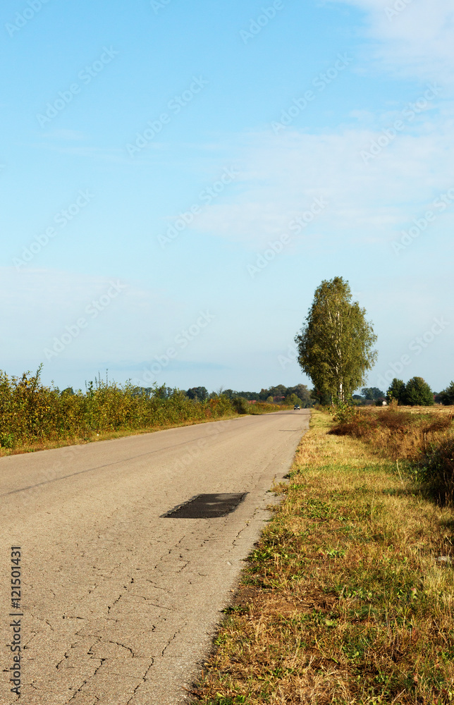 The old asphalt road to the village