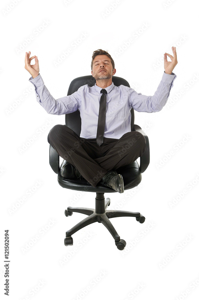 young attractive happy businessman relaxing with hands in yoga position sitting on office chair young attractive happy businessman relaxing with hands in yoga position sitting on office chair