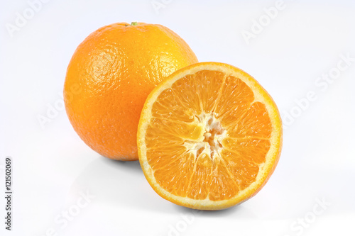 one and half orange friuts isolated on white background