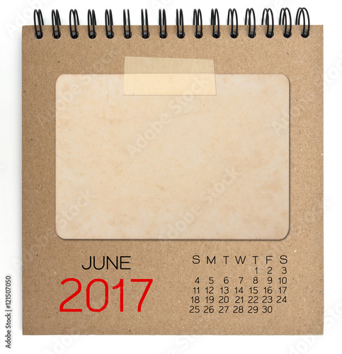 2017 calendar on brown notebook with old blank photo