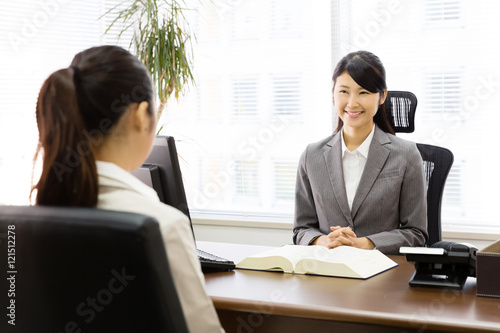 executive asian businesswoman talking in the office