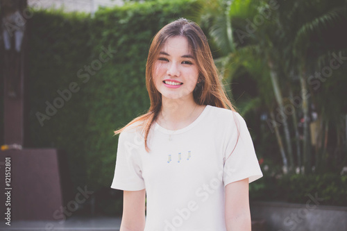 Portrait of thai chinese adult beautiful girl Denim blue travel relax and smile