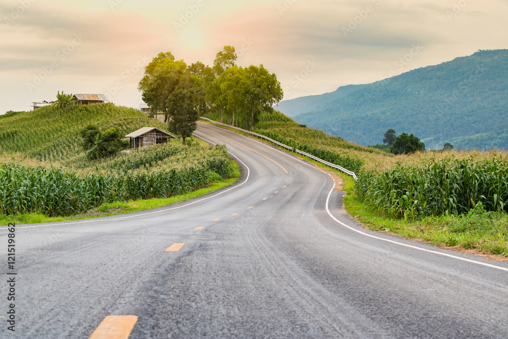 Fototapeta premium Serpentine hill road at Loei Thailand with sunset