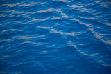 Blue water texture with some color reflections ideal for background.