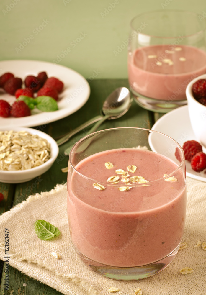 Healthy berry with raspberry, oatmeal and mint in a glass Healthy berry with raspberry, oatmeal and mint in a glass