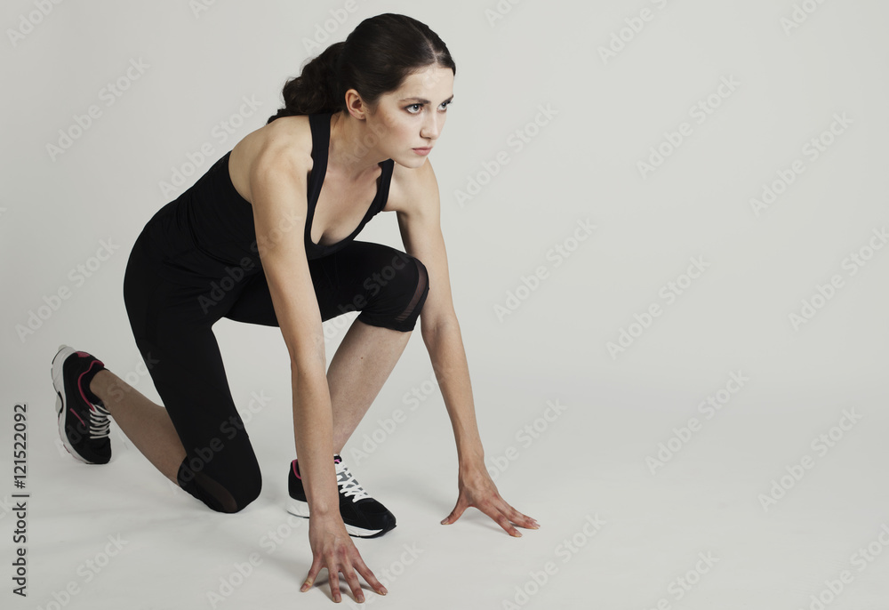 Healthy young woman preparing for a run fit female athlete ready Healthy young woman preparing for a run fit female athlete ready
