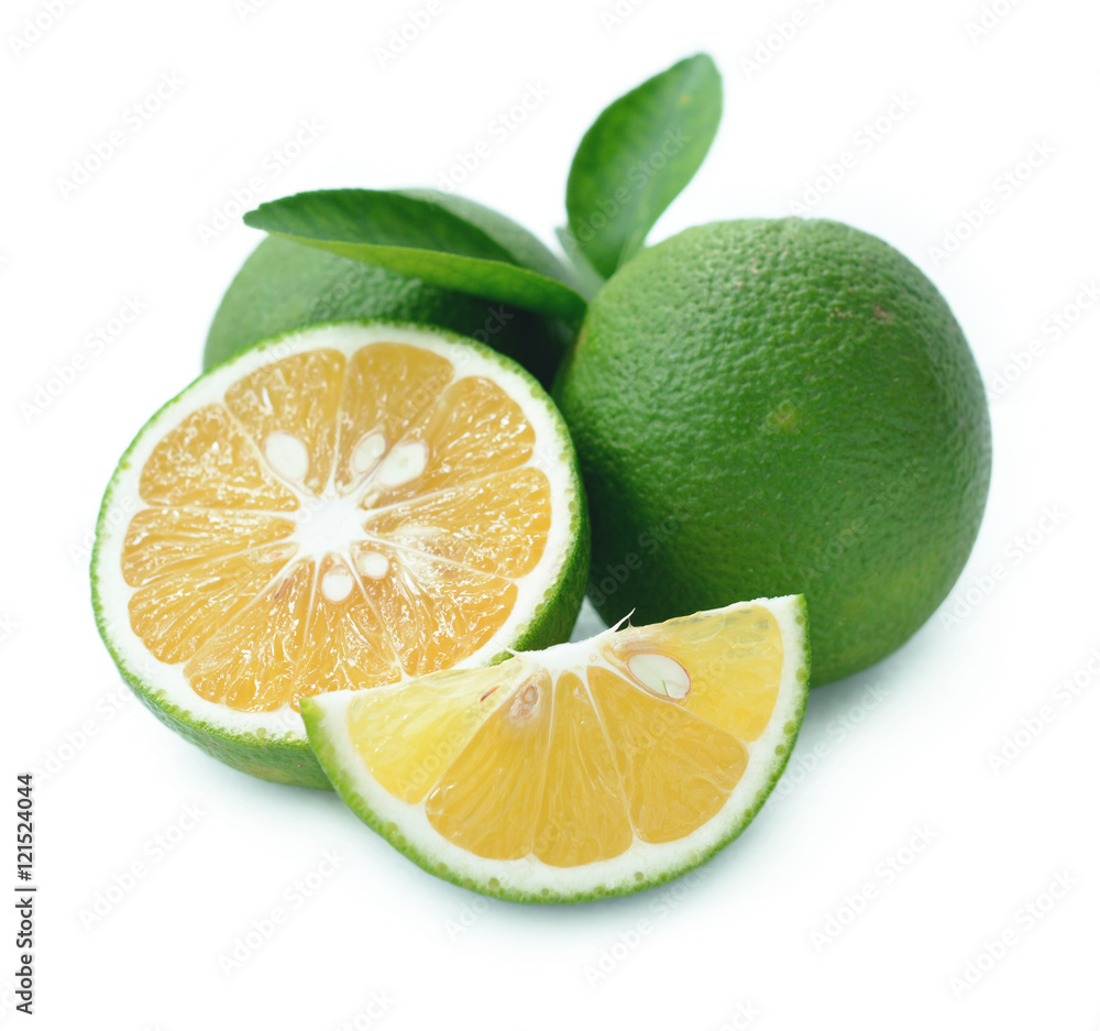 Fresh sweet orange with green peel (citrus senesis, citrus sinensis) on white background.