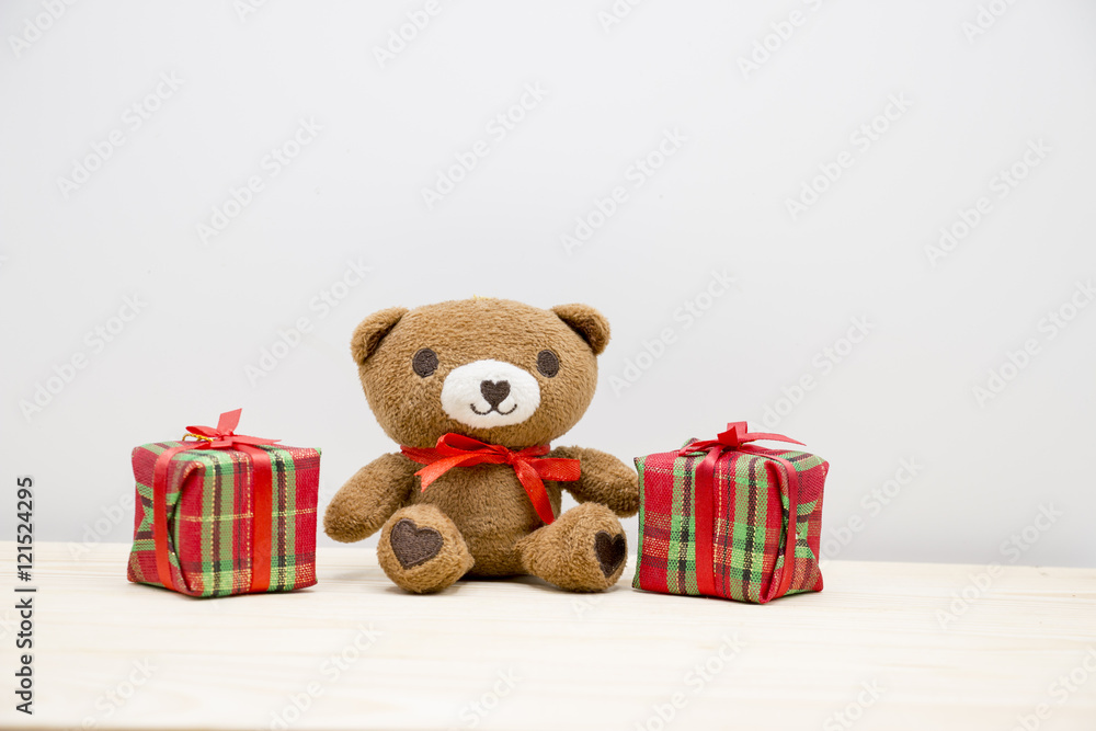 Bear is sitting with gift box for Christmas party Bear is sitting with gift box for Christmas party