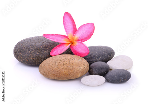 stones with frangipani flower isolated on white