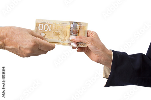 Canadian dollar banknotes in white background.