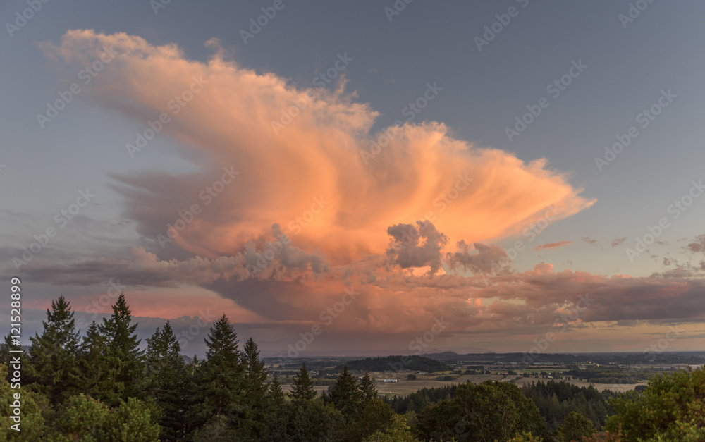 Fototapeta premium Orange Lit Thunderhead at Sunset in the Mid Willamette Valley