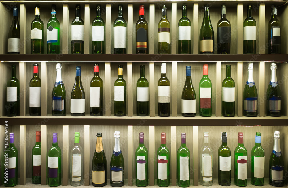 Old Bottles in wooden shelf