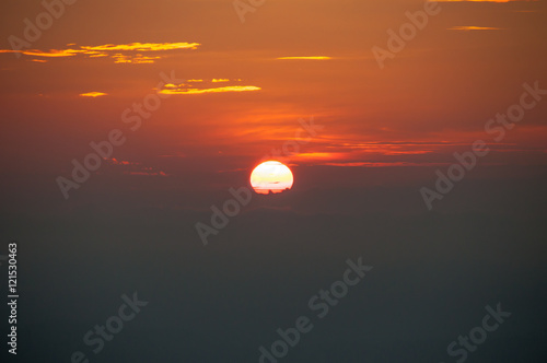 Fototapeta Naklejka Na Ścianę i Meble -  sunset on mountain, subject is blurred and low key