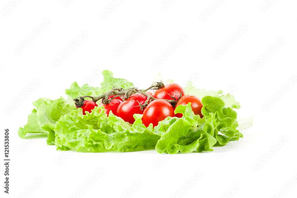Tomato with salad isolated on white.