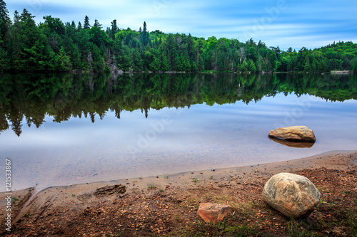 Bilde på lerret Reflection in beautiful lake Algonquin Provincial Park, Ontario, Canada