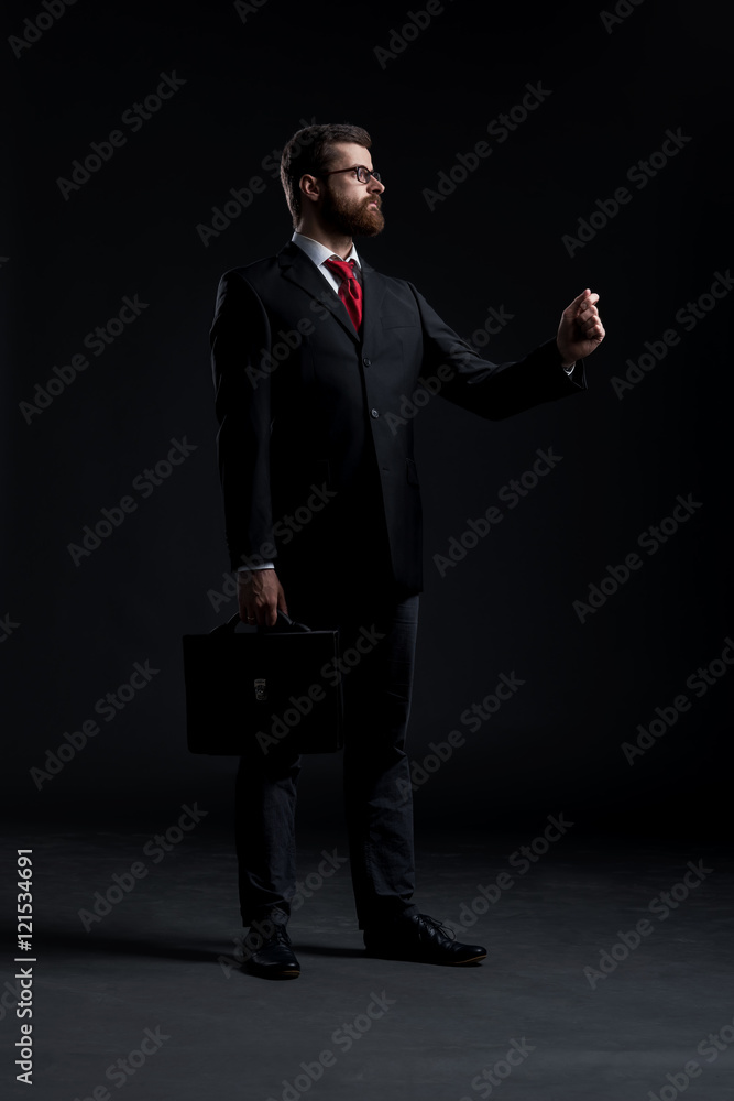 Businessman on a black background Businessman on a black background