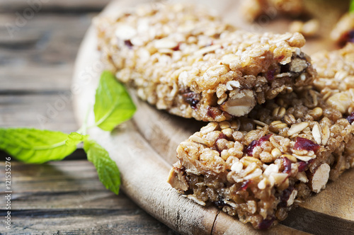 Granola bar on wooden background photo