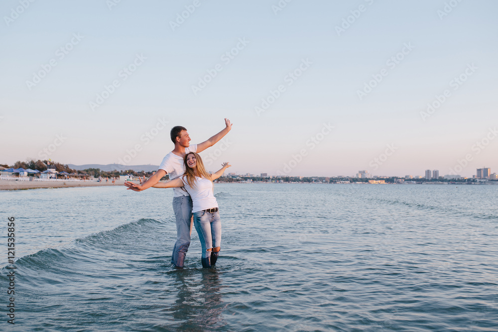 young couple having fun in the sea young couple having fun in the sea