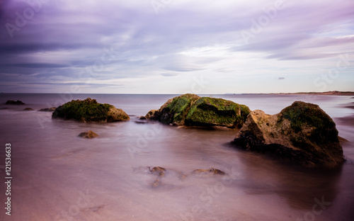 Lush Purple Sky and Sea Beach Scene