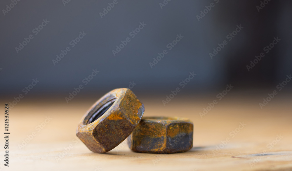 Industrial bolts and nuts with shallow focus Industrial bolts and nuts with shallow focus