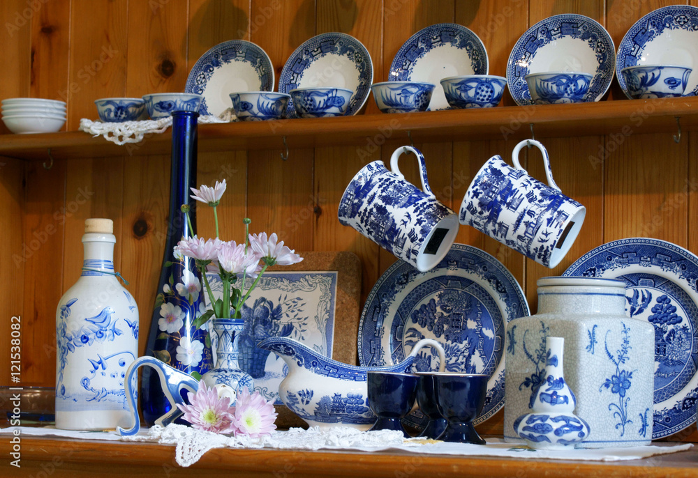 Poster, Print Welsh dresser with clutter of blue and white chinbna, 40x26.7 cm