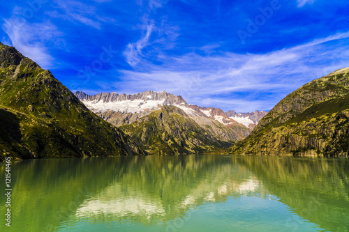 Idyllic summer landscape with clear mountain lake in the Alps