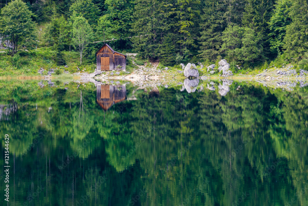 Fototapeta premium Lonely hut at the shore of lake