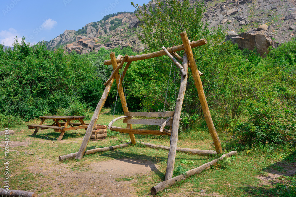 wooden swing in the mountains wooden swing in the mountains