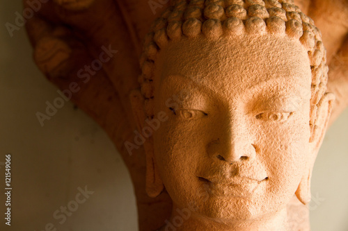 Sandstone Buddha statue in Thailand.