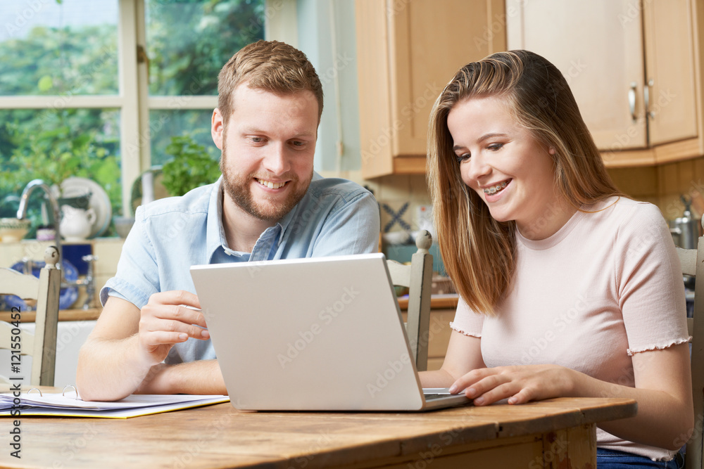 Male Home Tutor Helping Teenage Girl With Studies Male Home Tutor Helping Teenage Girl With Studies