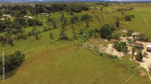 Fying over Kamarata indigenous town at La Gran Sabana, Venezuela photo