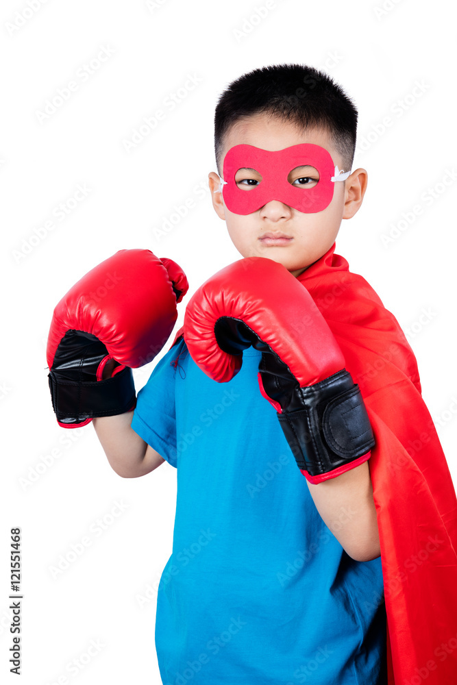 Asian Chinese boy wearing super hero costume with boxing gloves Asian Chinese boy wearing super hero costume with boxing gloves