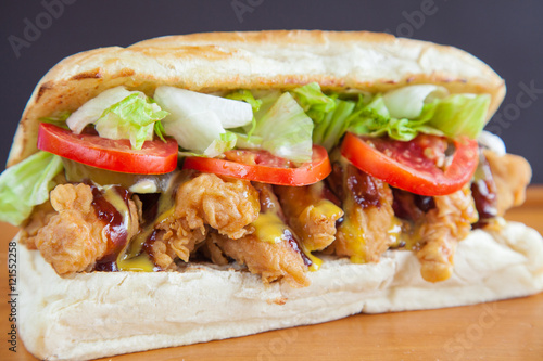 Submarine sandwich fried chicken closeup