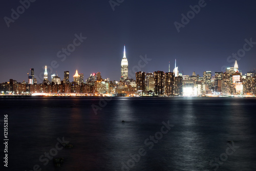 Manhattan illuminated at night  taken from Brooklyn