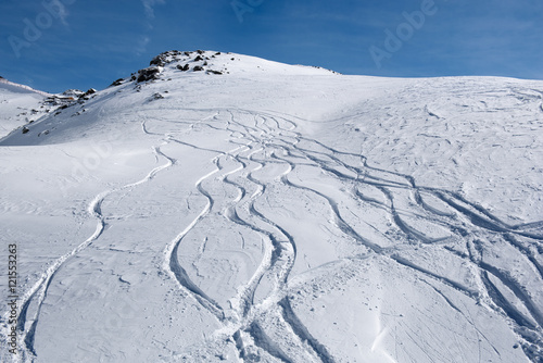 Snowtracks on the snowy slopes of the Alps, Austria photo