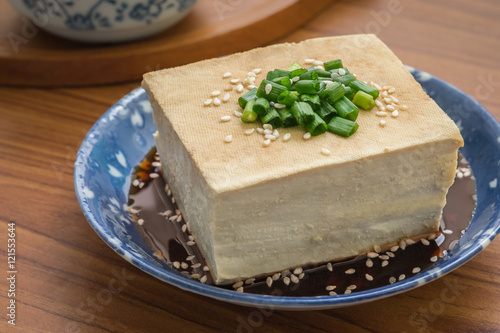 Tofu with soy sauce and sesame on plate