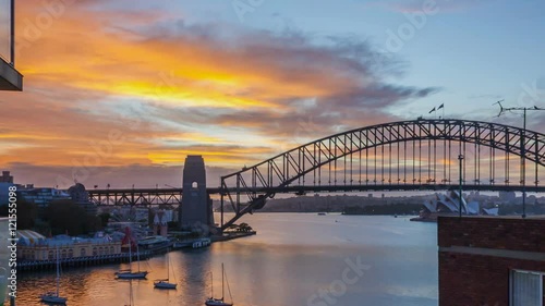 Wallpaper Mural A beautiful sun rises over Sydney Harbour revealing the Bridge and Opera House. Time lapse. Pan right Torontodigital.ca