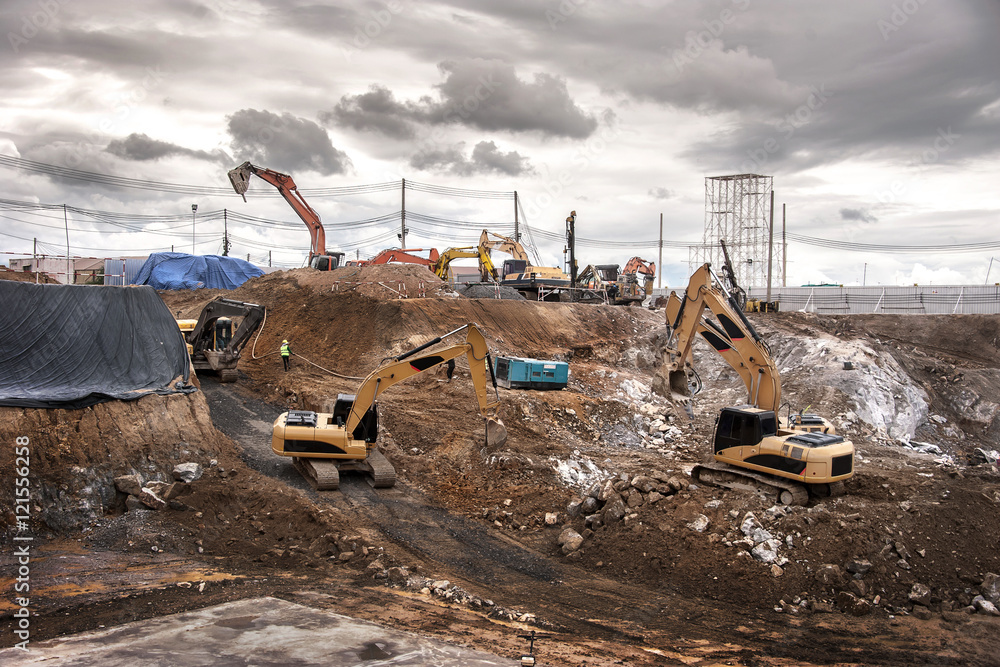 Fototapeta premium Backhoes in huge construction site