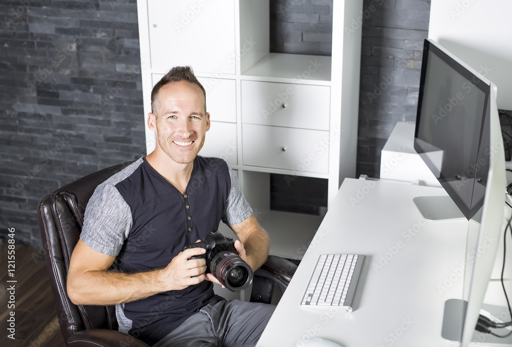 Fototapeta premium Handsome photographer camera office